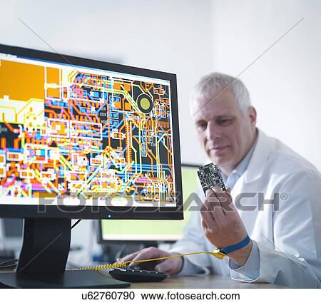 Engineer designing electronic circuitry for automotive use View Large Photo Image Stock Image - Engineer designing electronic circuitry for automotive use. Fotosearch