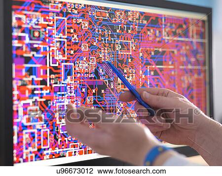 Engineer points to computer screen with electronic circuitry designs for automotive use View Large Photo Image Stock Image - Engineer points to computer screen with electronic circuitry designs for automotive use. Fotosearch