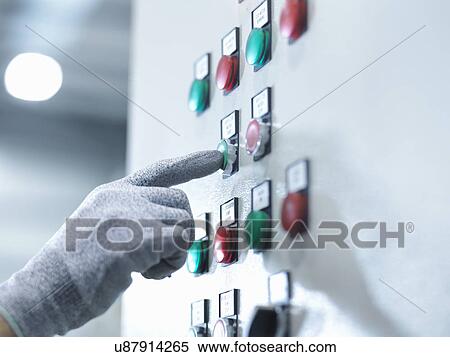 Engineer pressing button in engineering factory, close up View Large Photo Image Stock Photography - Engineer pressing button in engineering factory, close up. Fotosearch