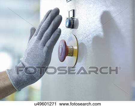 Engineer pressing emergency stop in engineering factory, close up View Large Photo Image Stock Image - Engineer pressing emergency stop in engineering factory, close up. Fotosearch