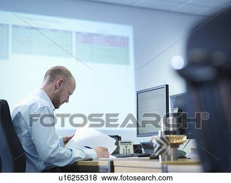 Engineer using computer aided design in factory office View Large Photo Image Stock Photo - Engineer using computer aided design in factory office. Fotosearch