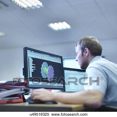 Engineer using computer aided design in factory office View Large Photo Image Stock Photography - Engineer using computer aided design in factory office. Fotosearch