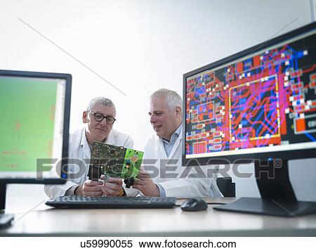 Engineers designing electronic circuitry for automotive use View Large Photo Image Stock Photography - Engineers designing electronic circuitry for automotive use. Fotosearch