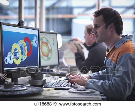 Stock Photo - Engineers designing industrial clutches using CAD software. Fotosearch