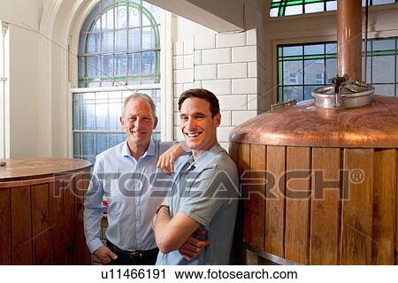 Father and son in brewery View Large Photo Image Stock Image - Father and son in brewery. Fotosearch