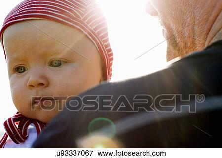 Stock Photo - Father with baby daughter close-up. Fotosearch