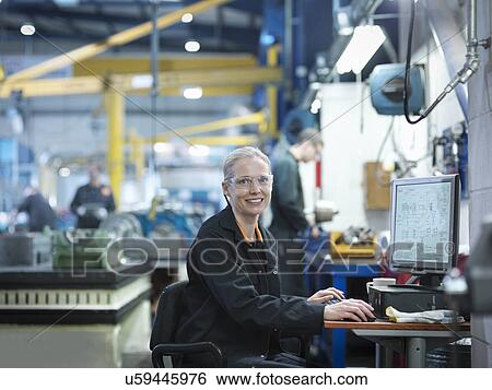 Female engineer using computer in engineering factory, portrait View Large Photo Image Stock Photograph - Female engineer using computer in engineering factory, portrait. Fotosearch