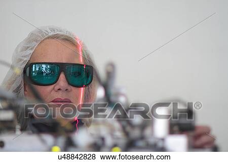 Female scientist monitoring experiment in laser laboratory View Large Photo Image Stock Photo - Female scientist monitoring experiment in laser laboratory. Fotosearch