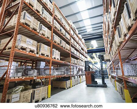 Forklift truck in parts store in factory View Large Photo Image Stock Image - Forklift truck in parts store in factory. Fotosearch
