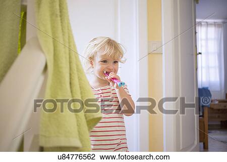 Girl brushing teeth View Large Photo Image Stock Image - Girl brushing teeth. Fotosearch