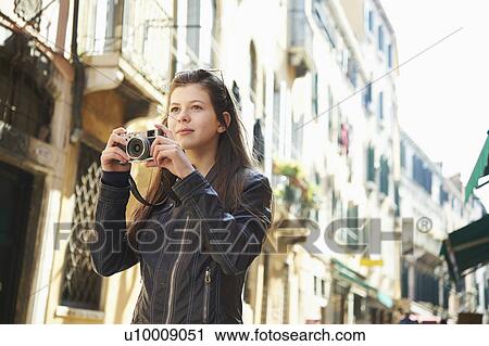Girl exploring with camera, Venice, Italy View Large Photo Image Stock Image - Girl exploring with camera, Venice, Italy. Fotosearch