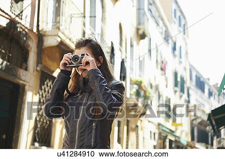 Girl taking photographs, Venice, Italy View Large Photo Image Stock Image - Girl taking photographs, Venice, Italy. Fotosearch