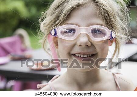 Stock Image - Girl wearing goggles. Fotosearch
