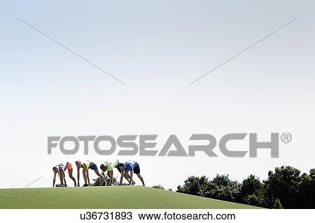 Group of adult runners preparing to run View Large Photo Image Stock Image - Group of adult runners preparing to run. Fotosearch