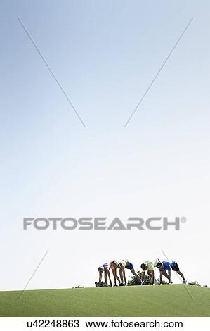 Group of adult runners preparing to start View Large Photo Image Stock Image - Group of adult runners preparing to start. Fotosearch