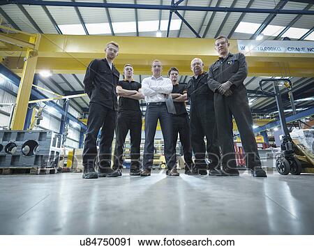 Group of engineers and apprentices in engineering factory, portrait View Large Photo Image Stock Image - Group of engineers and apprentices in engineering factory, portrait. Fotosearch