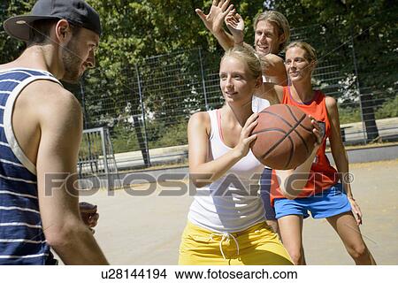 Group of friends playing basketball View Large Photo Image Picture - Group of friends playing basketball. Fotosearch