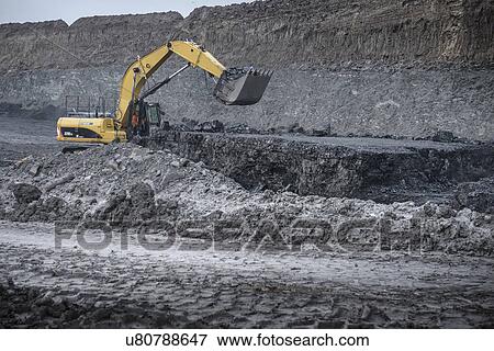 Large digger and geological strata in surface coal mine View Large Photo Image Stock Photo - Large digger and geological strata in surface coal mine. Fotosearch