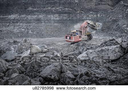 Large excavator and geological strata in surface coal mine View Large Photo Image Stock Photo - Large excavator and geological strata in surface coal mine. Fotosearch
