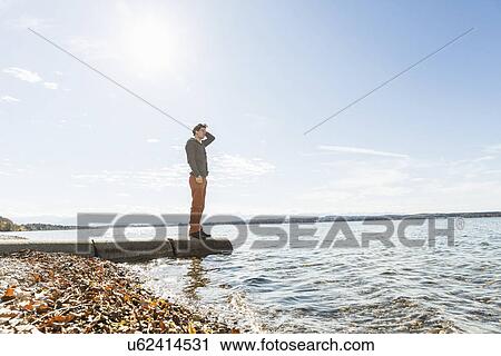 Man on jetty, Lake Starnberg, Bavaria, Germany View Large Photo Image Stock Image - Man on jetty, Lake Starnberg, Bavaria, Germany. Fotosearch