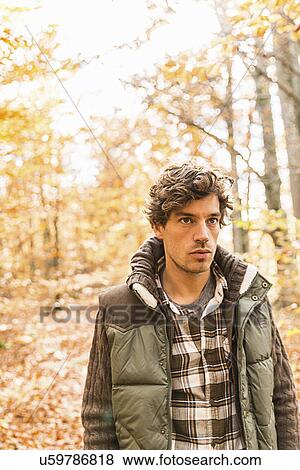 Stock Photo - Man wearing bodywarmer and checked shirt. Fotosearch