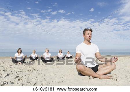 Mature and senior women and trainer in lotus pose on beach View Large Photo Image Stock Image - Mature and senior women and trainer in lotus pose on beach. Fotosearch