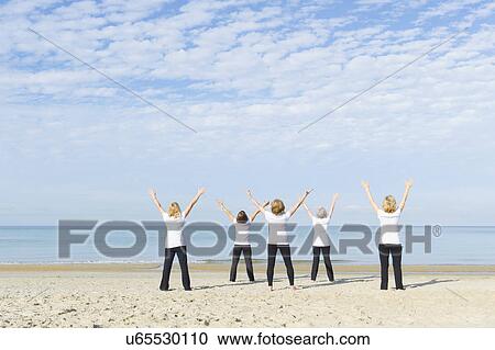 Mature and senior women enjoying exercise on beach View Large Photo Image Stock Image - Mature and senior women enjoying exercise on beach. Fotosearch