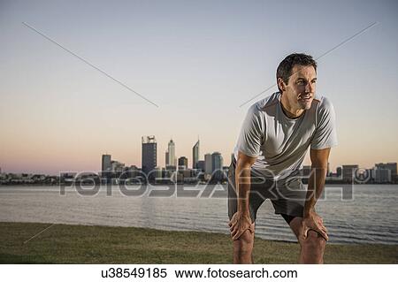 Mature male runner taking a break on waterfront, Perth, Australia View Large Photo Image Stock Photography - Mature male runner taking a break on waterfront, Perth, Australia. Fotosearch
