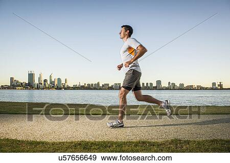 Mature male running on waterfront path, Perth, Australia View Large Photo Image Stock Photo - Mature male running on waterfront path, Perth, Australia. Fotosearch