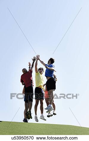 Mature trainer celebrating with group of adults View Large Photo Image Stock Image - Mature trainer celebrating with group of adults. Fotosearch