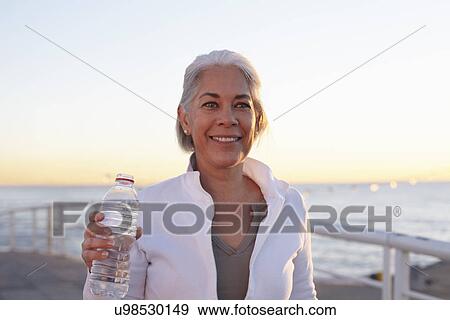 Mature woman on walking exercise View Large Photo Image Stock Photo - Mature woman on walking exercise. Fotosearch