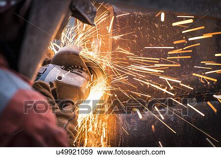 Metal grinding in repair works in surface coal mine View Large Photo Image Stock Photo - Metal grinding in repair works in surface coal mine. Fotosearch