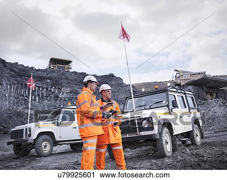 Miners with all terrain vehicles and dumper trucks in surface coal mine View Large Photo Image Stock Image - Miners with all terrain vehicles and dumper trucks in surface coal mine. Fotosearch