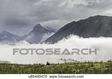 Mist and distant mountains, Archensee, Tyrol, Austria View Large Photo Image Stock Photography - Mist and distant mountains, Archensee, Tyrol, Austria. Fotosearch