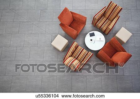 Picture - Overhead view of business armchairs in office atrium. Fotosearch