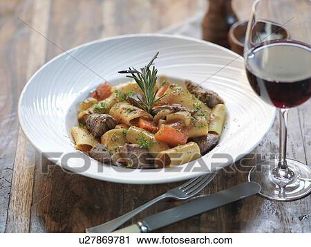 Paccheri pasta with slow cooked ox cheek, fresh rosemary, garlic, bay leaves, tomato and red wine View Large Photo Image Stock Image - Paccheri pasta with slow cooked ox cheek, fresh rosemary, garlic, bay leaves, tomato and red wine. Fotosearch