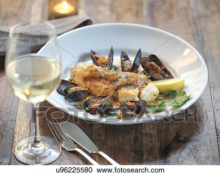 Pan fried halibut with mussels, fresh fennel, garlic, chillies and tomato sauce View Large Photo Image Stock Image - Pan fried halibut with mussels, fresh fennel, garlic, chillies and tomato sauce. Fotosearch