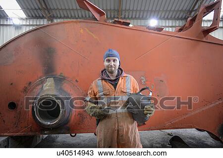 Stock Image - Portrait of apprentice engineer in surface coal mine. Fotosearch