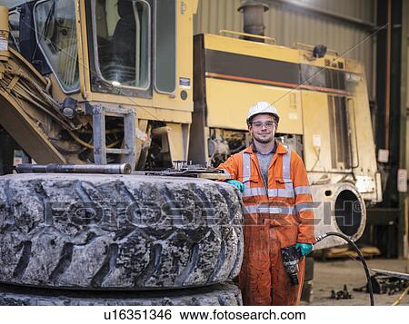 Portrait of apprentice engineer in surface coal mine View Large Photo Image Stock Photograph - Portrait of apprentice engineer in surface coal mine. Fotosearch