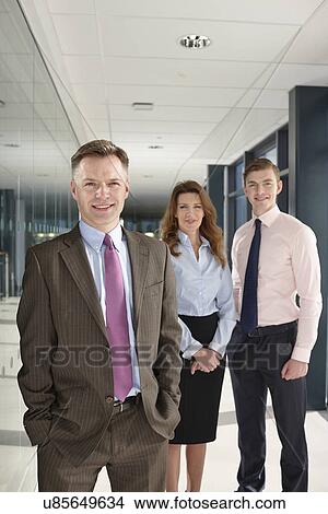Portrait of business colleagues in corridor View Large Photo Image Picture - Portrait of business colleagues in corridor. Fotosearch