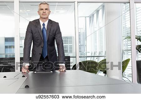 Stock Image - Portrait of business manager in office. Fotosearch