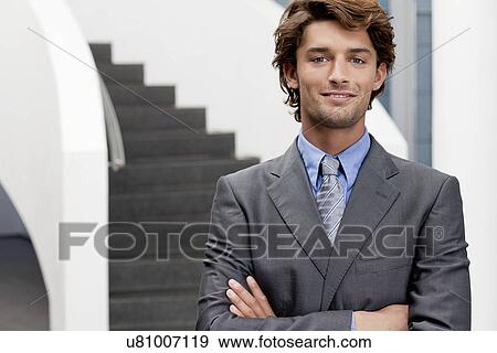 Portrait of businessman in office atrium View Large Photo Image Stock Photo - Portrait of businessman in office atrium. Fotosearch