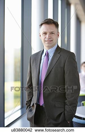 Portrait of businessman wearing suit View Large Photo Image Stock Image - Portrait of businessman wearing suit. Fotosearch