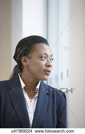 Picture - Portrait of businesswoman looking away. Fotosearch