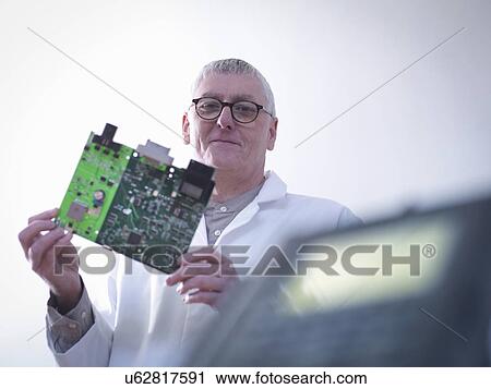 Portrait of engineer designing electronic circuitry for automotive use View Large Photo Image Stock Image - Portrait of engineer designing electronic circuitry for automotive use. Fotosearch