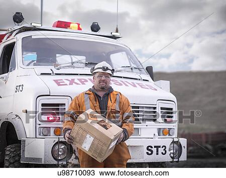 Stock Image - Portrait of explosives expert in surface coal mine. Fotosearch