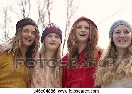 Portrait of four teenage girls in hats View Large Photo Image Stock Photograph - Portrait of four teenage girls in hats. Fotosearch