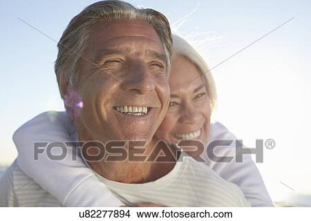 Picture - Portrait of happy couple outdoors. Fotosearch
