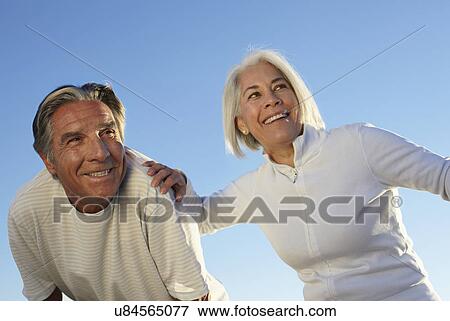 Stock Photo - Portrait of happy couple outdoors. Fotosearch
