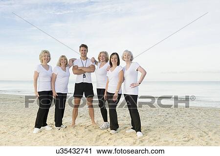 Portrait of mature and senior women with their trainer on beach View Large Photo Image Stock Image - Portrait of mature and senior women with their trainer on beach. Fotosearch